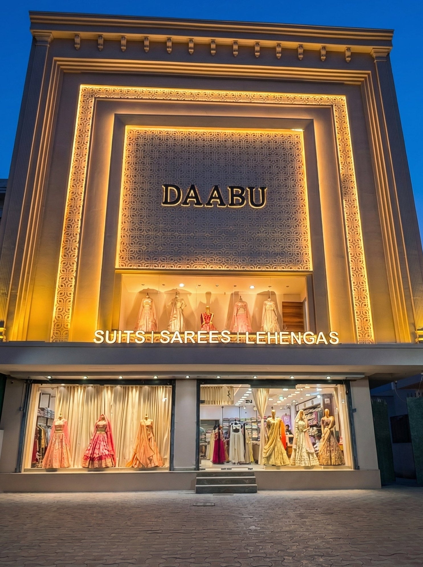 DA ABU store front with illuminated sign and display of clothing
